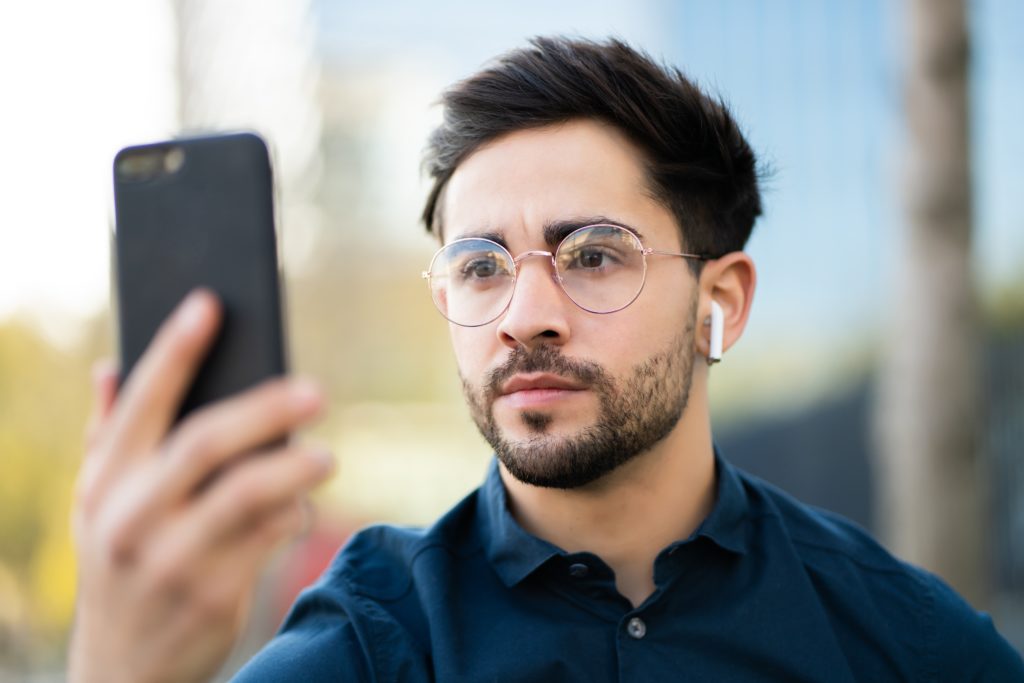 Could facial recognition become a cyber security risk? 3 young man using face id for unlock mobile phone ou 2021 08 30 06 38 15 utc 1